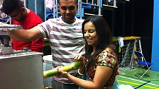 Alpa helps juice a sugar cane at Brentford Fountain Leisure Centre