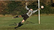 Mary Dendy FC's Matt Robinson makes a flying save