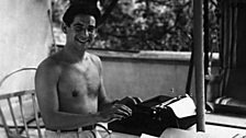 Leonard Bernstein in Hollywood, 1944, with his portable typewriter.