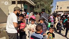 Maqsood hands out sweets in Syria