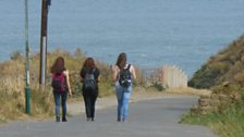 Sarah, Abi and Irum walking downhill