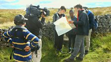 Joe Crowley with Isaac, Ruby and Eddie consulting the map