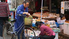 A woman buying eggs