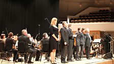 The performers return to the stage for one last bow