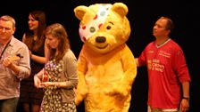 Pudsey and Navigator Ian enjoy the evening show finale