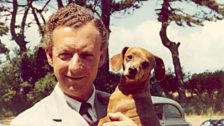 Benjamin Britten holding his dog Clytie in The Red House garden, Aldeburgh, late 1950s