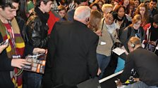 Signing autographs