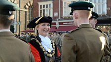 Mayor of Salisbury Councillor Mrs Penny Brown shakes hands with a soldier from 4 Rifles