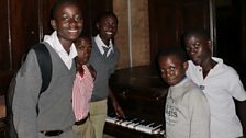 Choirboys from Namirembe Cathedral take their only chance to play the old, but loved piano