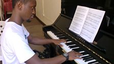 The school benefits bursary students like Shafic who has reached Grade eight piano in just four years