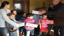 Receiving their shoeboxes