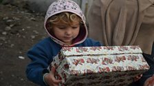 A child with his shoebox