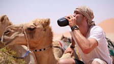 James Cracknell drinking from flask in the Empty Quarter, Oman.