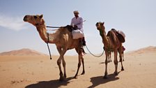 Ben Fogle riding his camel in the Empty Quarter, Oman.