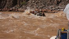 Filming kit and crew going over the rapids