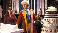 The Sixth Doctor is covered by a Dalek…