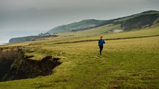 Tom Mathias running along the west Wales coast