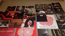 A lot of White Stripes stuff laid out on the floor, from @jamboboy