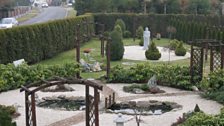 Garden of the Franciscan Church with statue of Maximillian Kolbe.