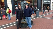 Guide Jonathan Creasy (left) from the James Joyce Centre taking his Dubliners walking tour to the James Joyce statue