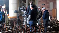 The bishop takes his place at the back of the cathedral