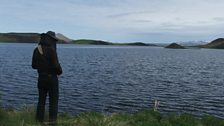 Chris Watson in midge net recording at Lake Myvatn