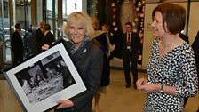 The Duchess of Cornwall with a picture of the original Archers cast