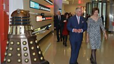 HRH The Prince of Wales in the foyer of New Broadcasting House with a Dalek