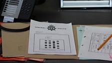 Police documents on the desk