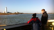 Roberta and Tom watch the lighthouses of Keyhaven meander past