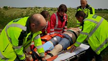 Patient Vincent is treated at the roadside.