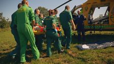 Emergency medical staff carry patient, Bill, to Lincs and Notts Air Ambulance.