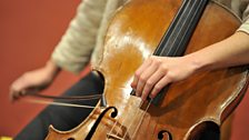 Close-up of Lucy Railton playing the cello