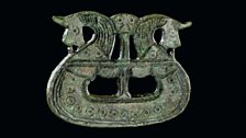 Brooch shaped like a ship, 800-1050. Tjørnehøj II, Fyn, Denmark.  Copper alloy.