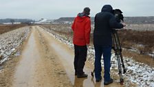 An sgioba a’ clàradh far na bhris balla Loch (Reservoir) Kolantár