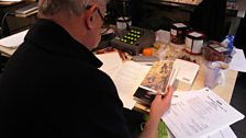 Stephen Wyatt editing scripts in studio