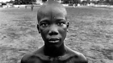 Bob Kpwailo, member of local football team 'Millenium Stars' at a training pitch in Sinkhor.