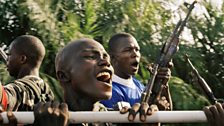 Young ex-combatants with rebel group Movement for Democracy in Liberia head for UN disarmament point run by Bangladeshi troops.