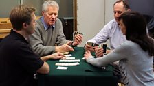 The cast playing bridge