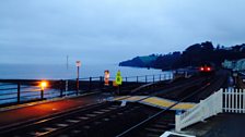 The first trains passing through Dawlish station