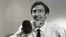 Keith Skues at the microphone in a tv publicity photo from 1967