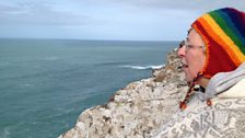 Danu Fox sings to the land at the top of Cape Cornwall