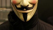 V for Vendetta mask on a manequin in Comics Unmasked.