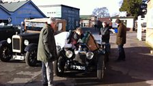 Enthusiasts crowd around for a look