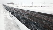 Spindrift hisses across the road to the Chechen village of Krasnaya Polyana…