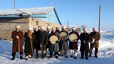 After the ritual is over, the men put on their white hats, to go home.