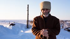 A village elder stands outside in temperatures in the low minus thirties.