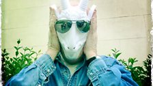 Iain Sinclair with a goat mask