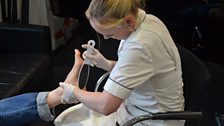 Pedicurist Claire filing down some hard skin