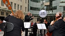 The 鶹 Concert Orchestra perform in the New Broadcasting House Piazza. Photo by Mark Allan/鶹